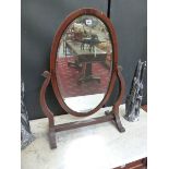 A LARGE SWING MIRROR.