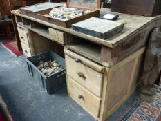 A LARGE PINE SLOPE TOP LIBRARY DESK WITH DRAWERS TO BASE.