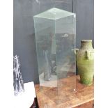 A TALL GLASS DISPLAY CASE.