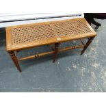 A VICTORIAN WALNUT WINDOW SEAT WITH CANE TOP.