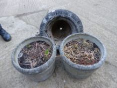 A PAIR OF GARDEN PLANTERS AND A SIMILAR URN ON STAND.