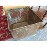 A LARGE HAMMERED COPPER LOG BIN.