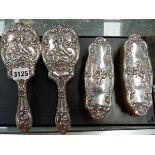 A HALLMARKED SILVER FOUR DRESSING TABLE BRUSH SET, DATED BIRMINGHAM 1908, WITH CHERUB DESIGN.