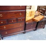 A STAG CHEST OF DRAWERS AND MATCHING BEDSIDE CHESTS.