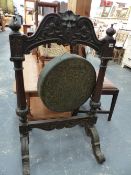 A VICTORIAN LARGE CARVED OAK FRAMED DINNER GONG.