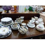 A ROYAL ALBERT MOSS ROSE PART TEASET AND AN EDWARDIAN VIERSA PART TEASET.