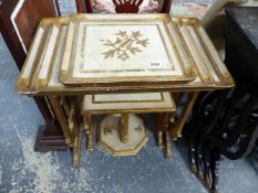 A NEST OF GILT DECORATED OCCASIONAL TABLES.