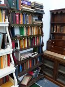 AN ANTIQUE STAINED PINE WATERFALL BOOKCASE.