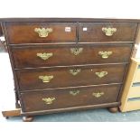 A GEORGIAN OAK AND WALNUT CROSS BANDED CHEST OF TWO SHORT AND THREE LONG DRAWERS.