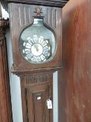 A FRENCH OAK CLOCK CASE AND ASSOCIATED ENAMEL AND BRASS DIAL MOVEMENT.