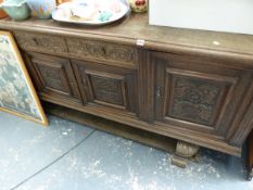 A LARGE OAK SIDEBOARD.