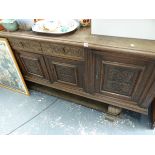 A LARGE OAK SIDEBOARD.