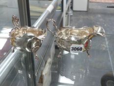 A PAIR OF SILVER HALLMARKED SAUCE BOATS.
