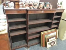 AN ANTIQUE MAHOGANY BREAK FRONT BOOKCASE.