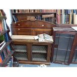 A GEORGIAN MAHOGANY ENCLOSED BOOKCASE UPPER SECTION AND A BRASS GRILL DOOR CABINET BASE.
