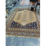 A LARGE MACHINE MADE PERSIAN PATTERN CARPET.