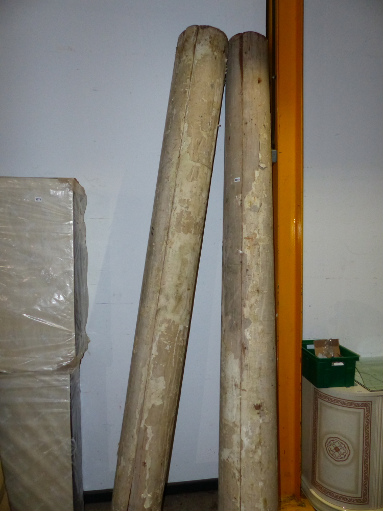 A PAIR OF LARGE ANTIQUE PINE COLUMNS.