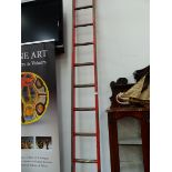 A VINTAGE PAINTED LADDER FOR ORNAMENTAL USE.