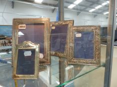 FOUR SILVER FRAMES.