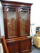 A LARGE VICTORIAN MAHOGANY GLAZED BOOKCASE CABINET.