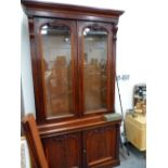 A LARGE VICTORIAN MAHOGANY GLAZED BOOKCASE CABINET.