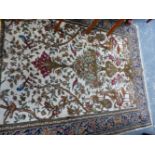A SMALL PERSIAN PATTERN RUG.