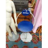 A VINTAGE NIVEA STOOL.