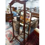 A MAHOGANY AND INLAID CHEVAL MIRROR LABELLED FOR HOWARD & SONS, LONDON