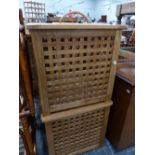 TWO TEAK LATTICE LAUNDRY BOXES.