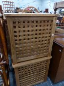 TWO TEAK LATTICE LAUNDRY BOXES.