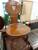 A LATE GEORGIAN MAHOGANY HALL CHAIR WITH PAINTED SHIELD ARMORIAL.