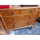 A WALNUT CHEST OF TWO SHORT AND TWO LONG DRAWERS ON CABRIOLE LEGS.