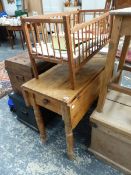 AN ANTIQUE PINE KITCHEN DROP LEAF TABLE.