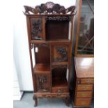 A GOOD QUALITY ORIENTAL HARDWOOD CARVED CABINET.