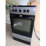 A GAS/ELECTRIC COOKER.
