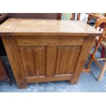 A SMALL OAK PANEL FRONT COFFER.