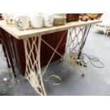 A MARBLE TOPPED IRON BASE TABLE.