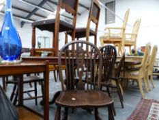 A SET OF FOUR WHEELBACK CHAIRS AND TWO SIDE CHAIRS