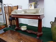 AN EARLY VICTORIAN MAHOGANY MARBLE TOP WASHSTAND.