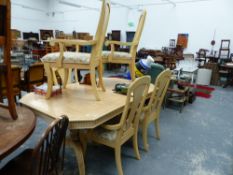 A MODERN EXTENDING DINING TABLE AND A SET OF CHAIRS.