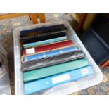 A QUANTITY OF STAMP FOLIOS AND ALBUMS.