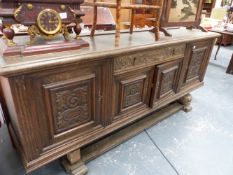 A LARGE OAK SIDEBOARD.