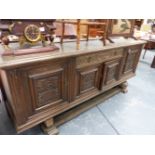 A LARGE OAK SIDEBOARD.