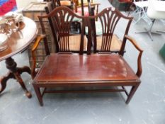 A GEORGIAN MAHOGANY SETTLE.