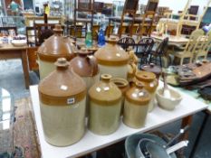 A QTY OF STONEWARE FLAGONS.