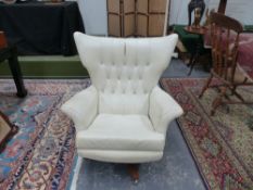 A RETRO SWIVEL ARMCHAIR.