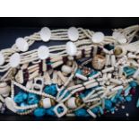 A SELECTION OF ETHNIC BONE AND TURQUOISE BEADS, ETC.