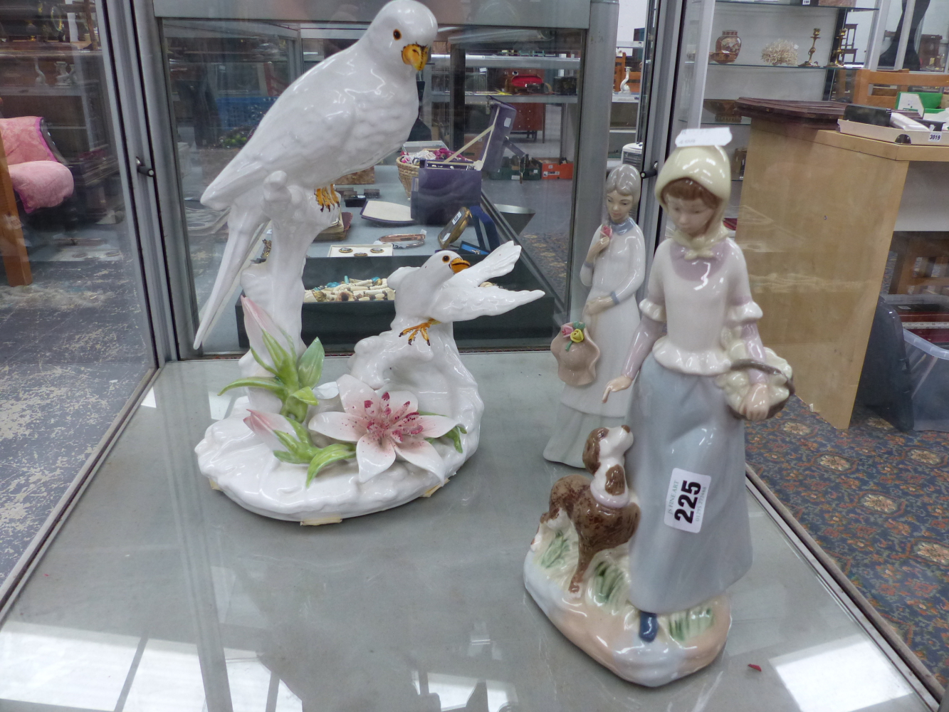 LARGE DOVE POTTERY CENTREPIECE TOGETHER WITH TWO SPANISH FIGURINES.