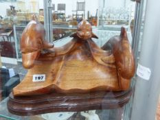 A WOODEN DOLPHIN SCULPTURE.