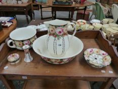 AN EDWARDIAN WASH JUG AND BOWL SET.